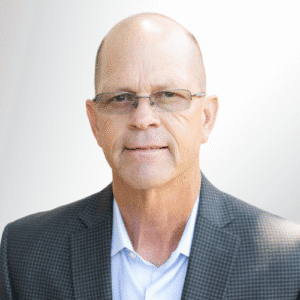 Don VandeVanter, a professional financial advisor in a suit and glasses for financial planning.